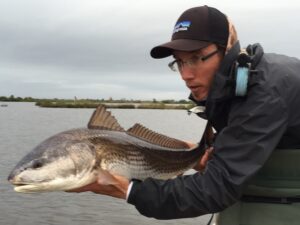 redfish-redfish on fly-mosquito lagoon fly fishing-nautilus reels-patagonia fly fishing-canoe charters